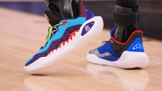 Golden State Warriors guard Stephen Curry's multicolor Under Armour sneakers.